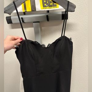 Haley Paige Occasion black spaghetti strap maxi dress with lace detail & slit.